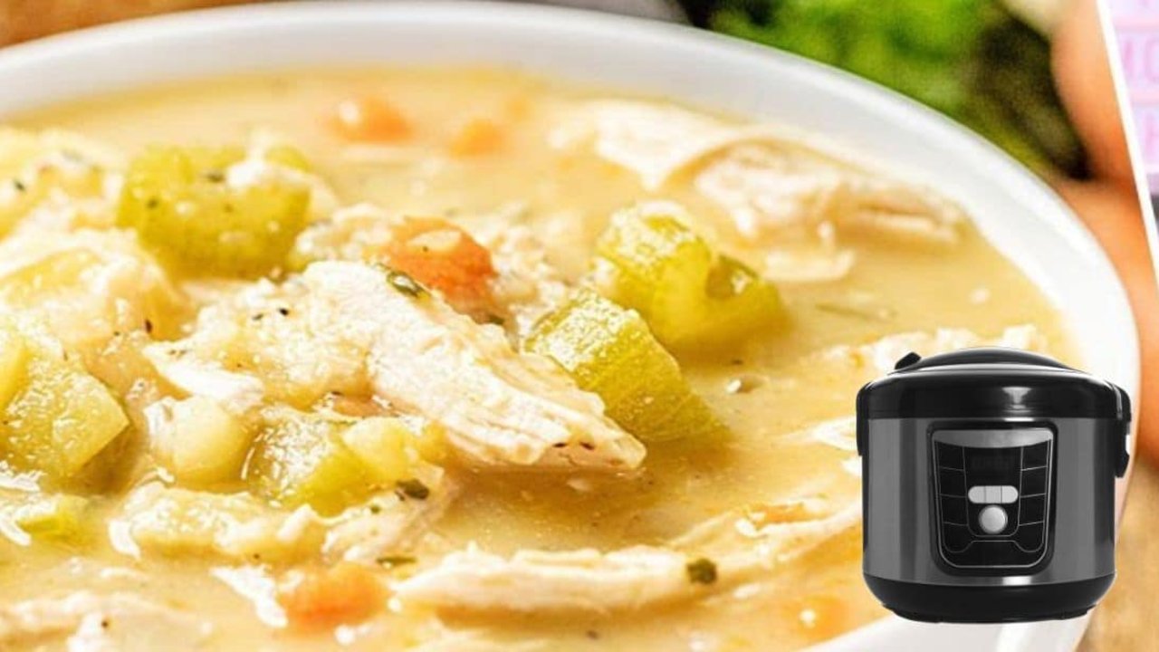 Slow Cooker Turkey Soup Recipe Slow cooker turkey soup in a bowl with shredded turkey, potatoes, carrots and celery in a creamy broth