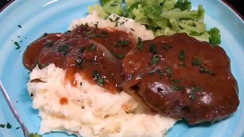 Salisbury Steak Smothered with Gravy and Onions, homemade and freshly served