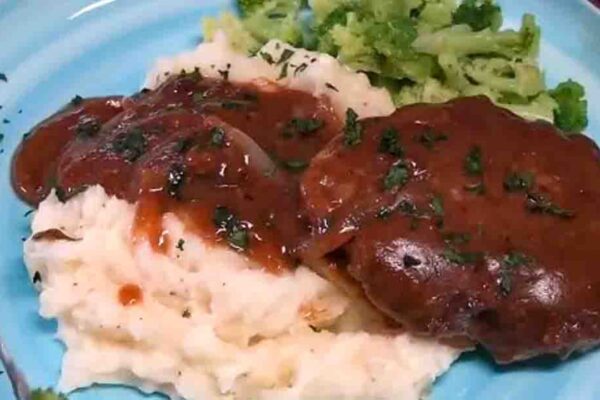Salisbury Steak Smothered with Gravy and Onions, homemade and freshly served