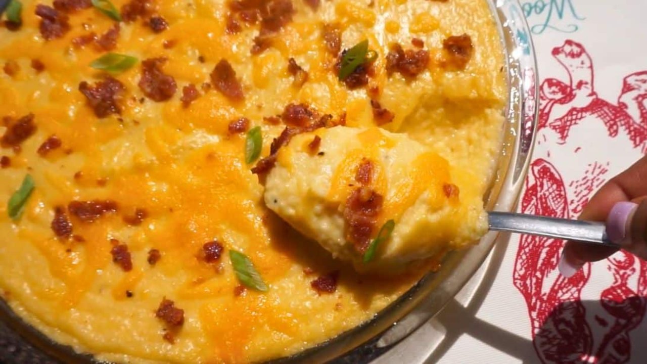 Southern Bacon And Cheese Grits Casserole Southern bacon and cheese grits casserole in a dish, creamy grits under melted cheddar, bacon and scallions