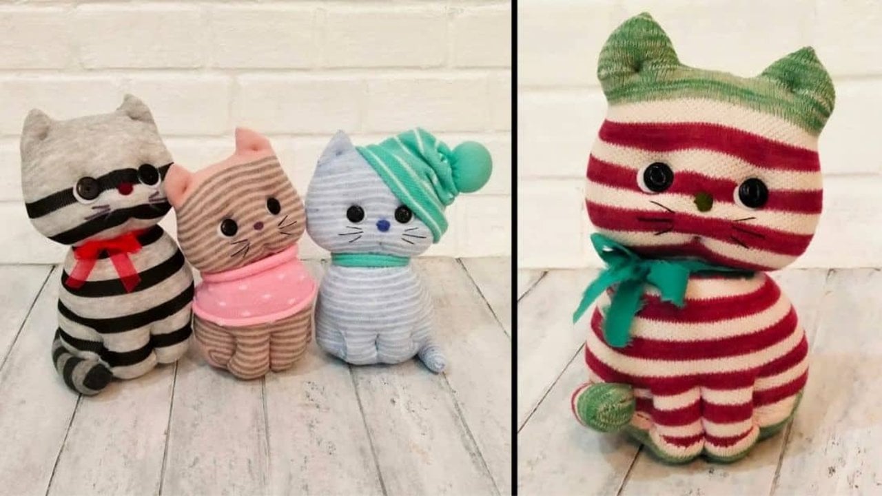 Sock Kitten That Sits Up on Its Own Stuffed kitten made from socks, four striped sock cats in red green and pink with stitched faces and knotted scarves