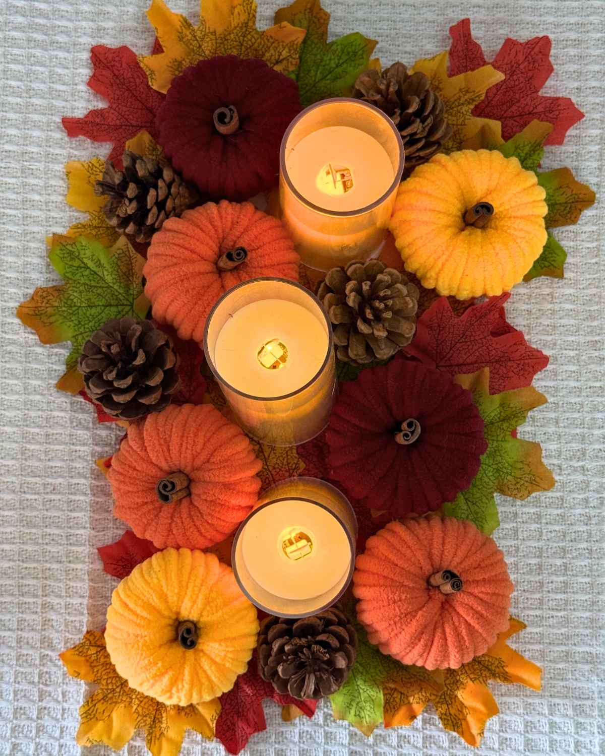 Fall Crafts - finished yarn pumpkin made from a wrapped toilet paper roll