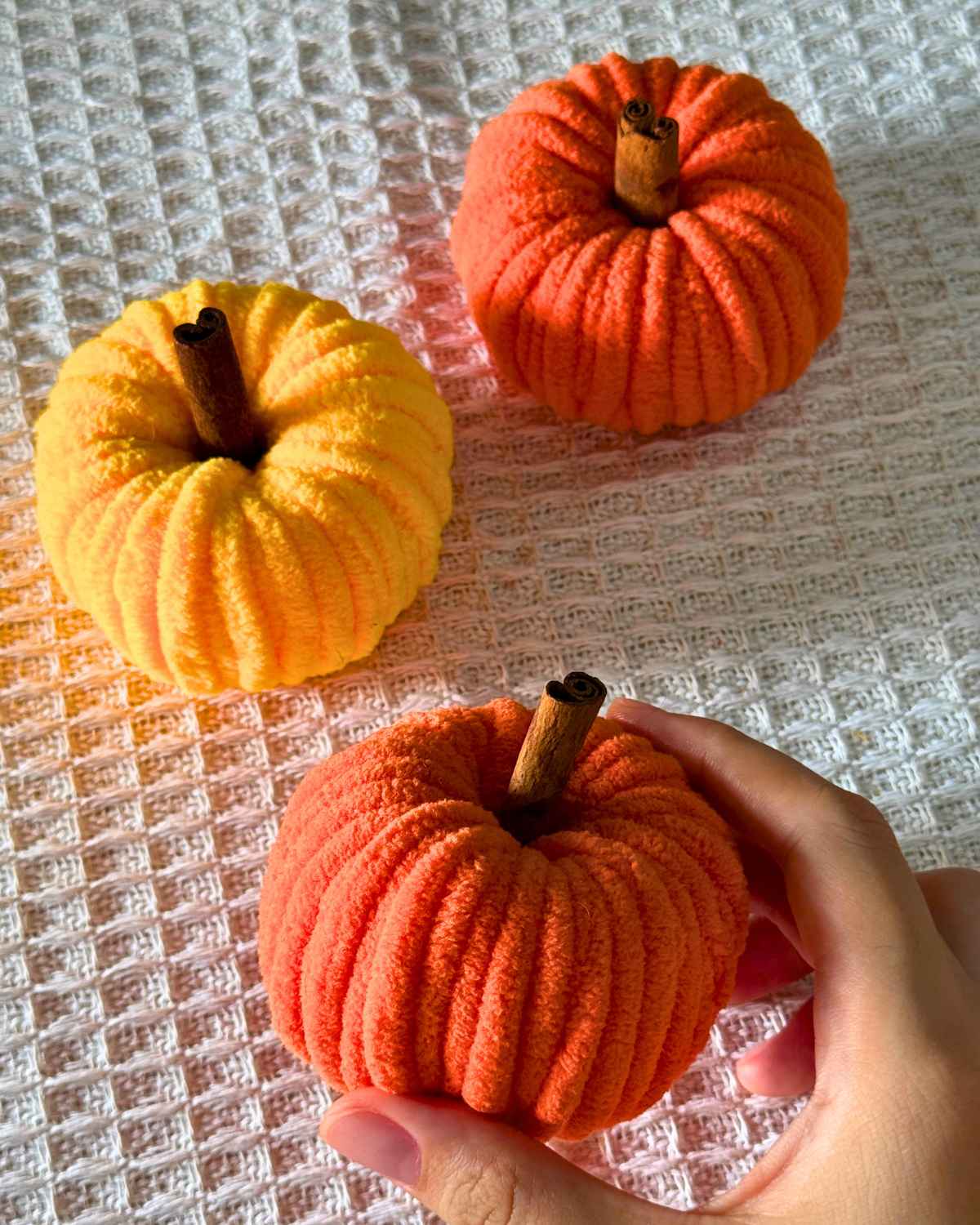 Cheap DIY Ideas - yarn pumpkins arranged for a cozy fall centerpiece
