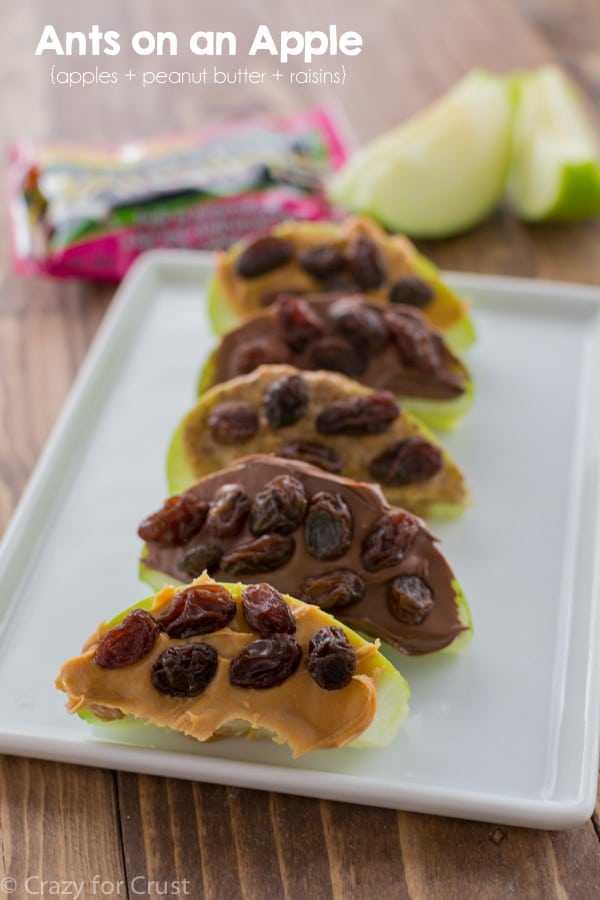 Ants on an apple snack, peanut butter and raisins on apple slices, easy kid lunch idea
