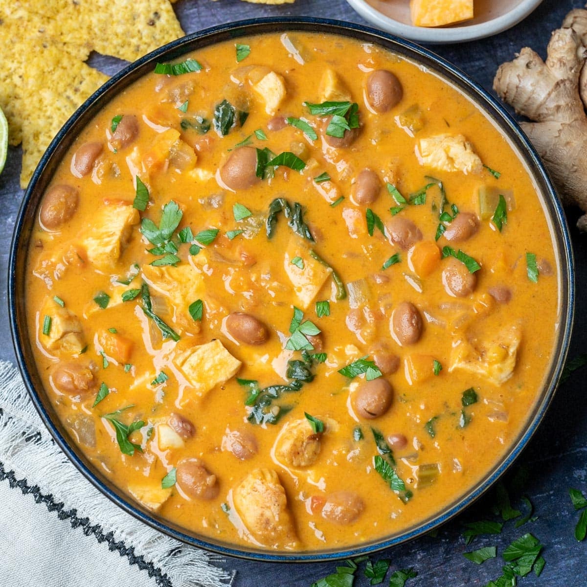 Curried chicken and pumpkin soup with beans, a dairy-free fall recipe
