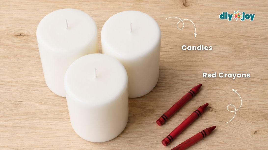 Supplies to make bloody candles: white pillar candles, red crayons, and parchment paper