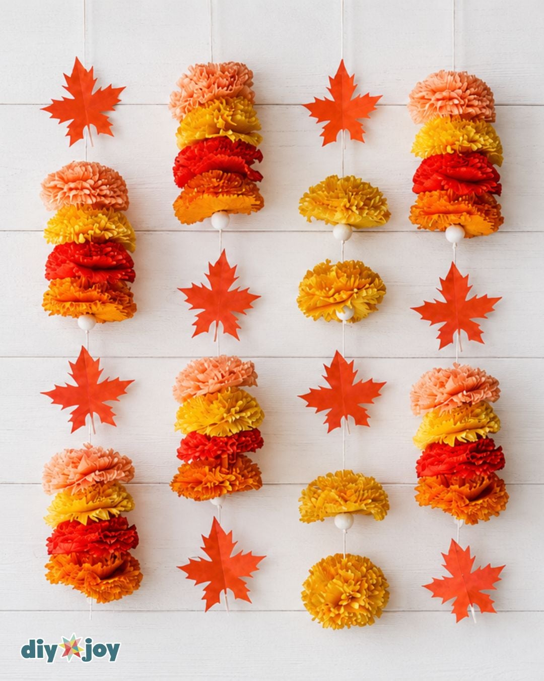 DIY Fall Decor - crepe paper marigold garland with paper maple leaves