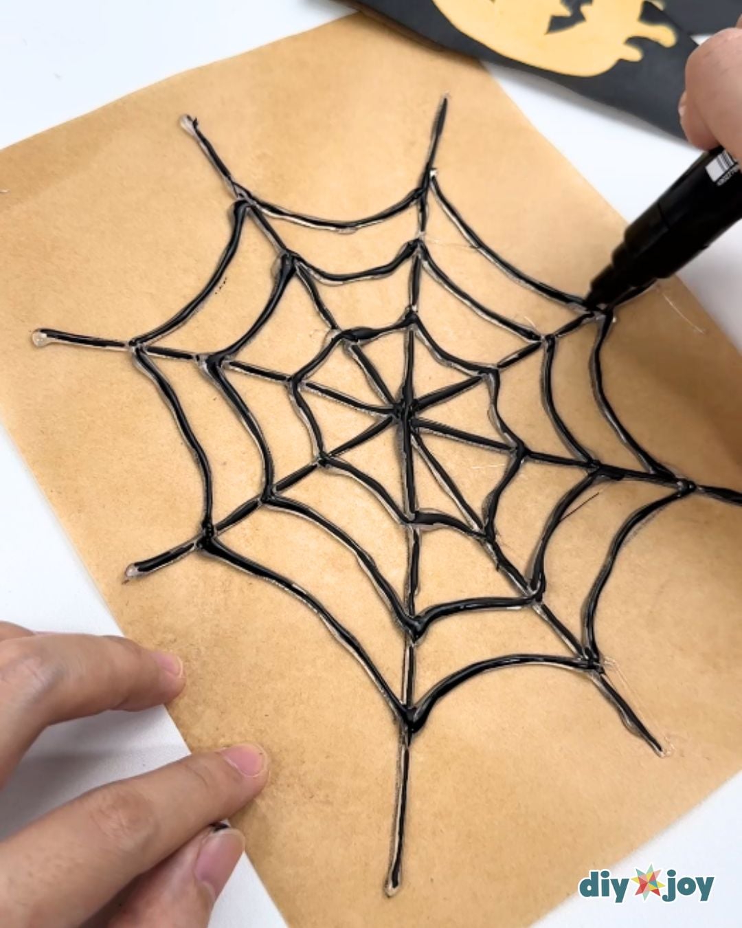 DIY spider webs using hot glue