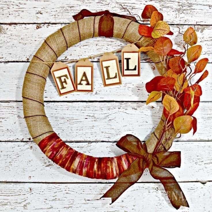 Burlap fall wreath with layered loops and autumn accents worked through it, a full textured door wreath