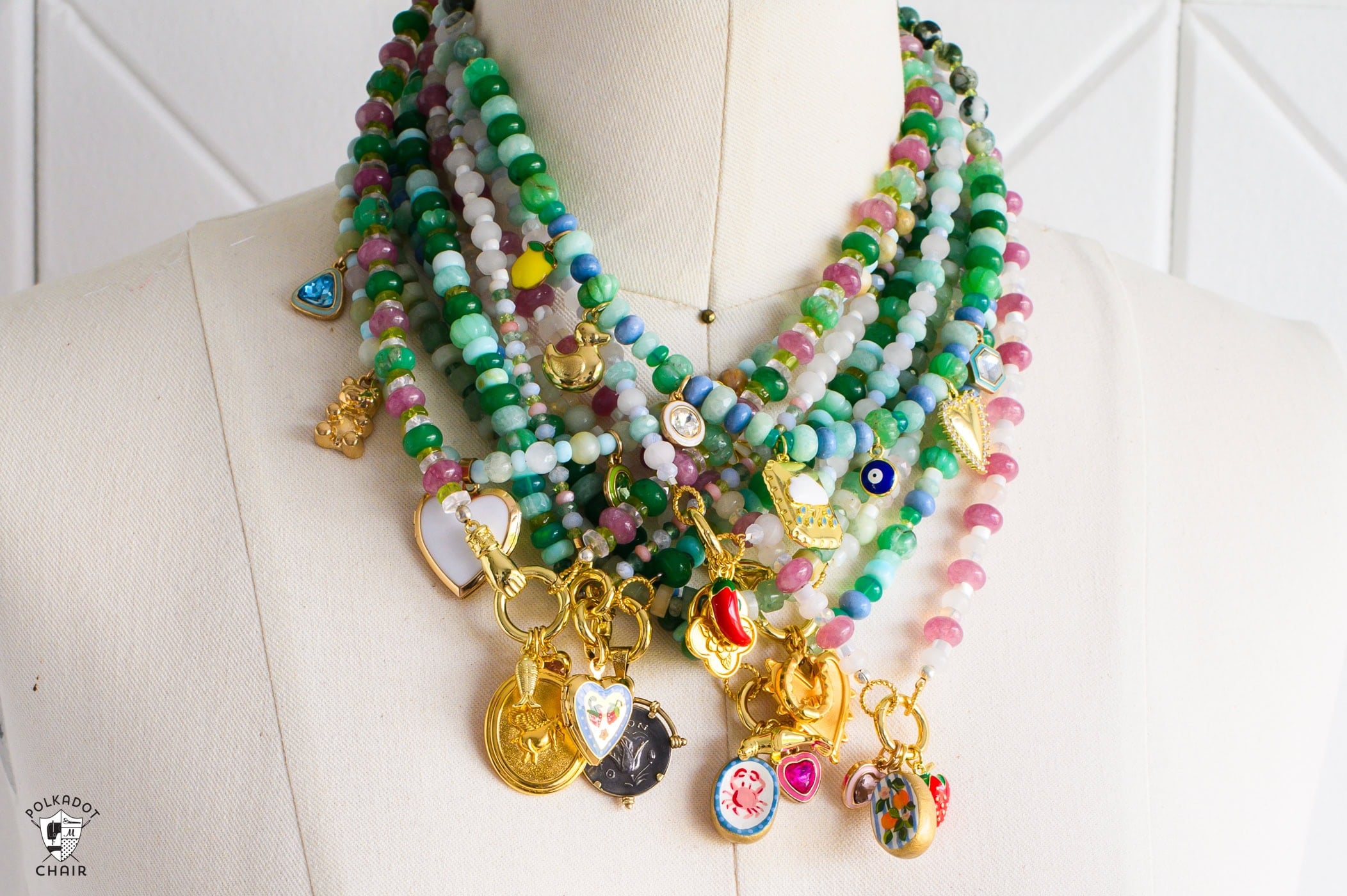 Layered beaded charm necklace built with a carabiner clasp so the charms swap out, a craft that never looks the same twice