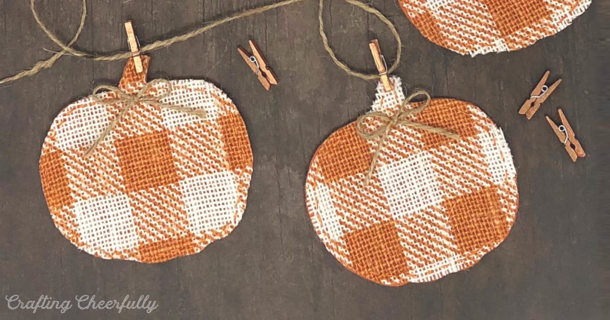 Buffalo check burlap pumpkin banner strung with twine and mini clothespins for fall and Thanksgiving decor