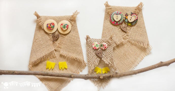 No sew burlap owl family craft with round wooden button eyes, a heart shaped beak and felt talons on a stick