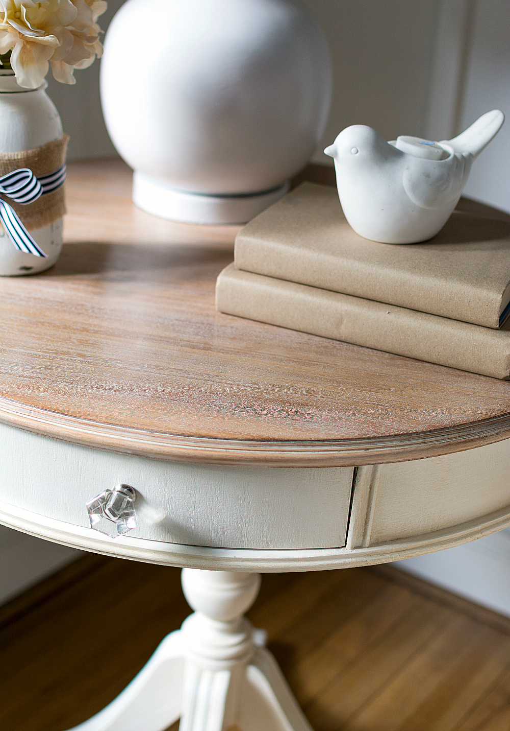 Drum table refinished with a soft white liming wax finish over painted wood, a furniture makeover
