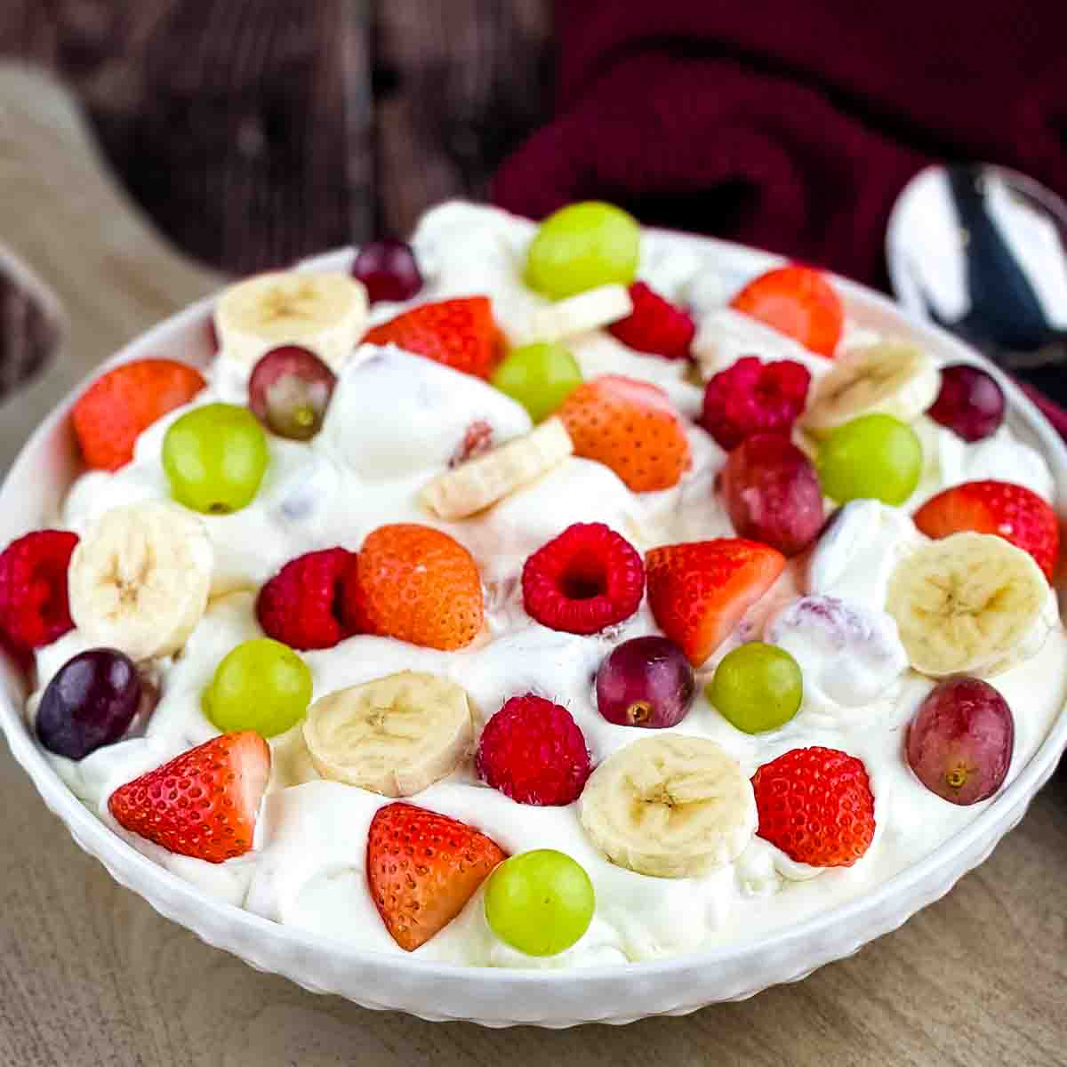 Creamy Thanksgiving fruit salad made with Cool Whip and vanilla pudding, an easy make-ahead holiday side dish