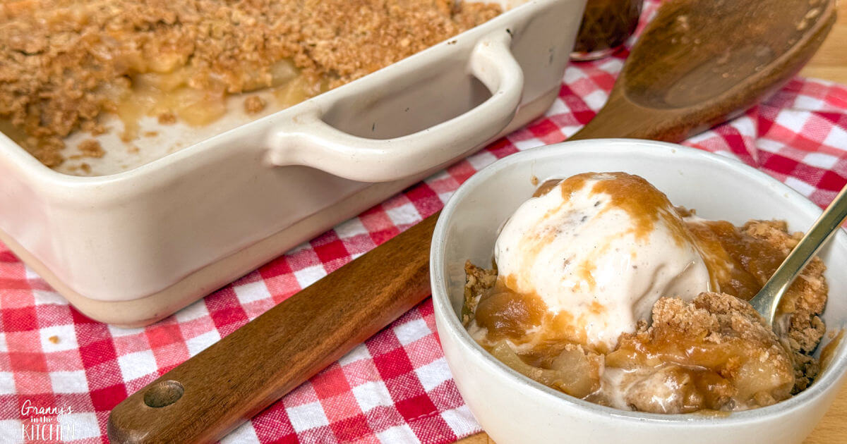 Old fashioned apple crisp with a buttery oat topping over spiced apples, a simple Thanksgiving dessert recipe