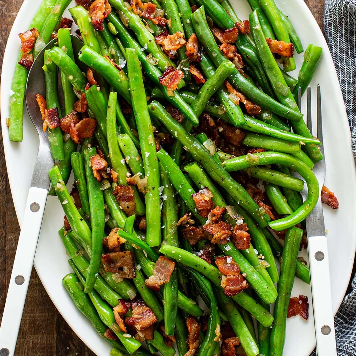 Green beans steamed crisp tender then tossed with bacon, shallot and garlic, a quick fifteen minute Thanksgiving side dish