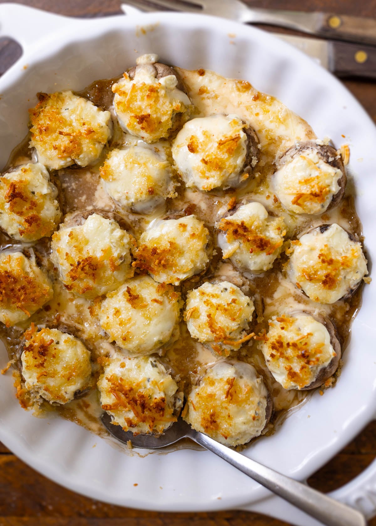 Copycat Longhorn stuffed mushrooms baked in a white cheddar sauce, an easy Thanksgiving appetizer recipe