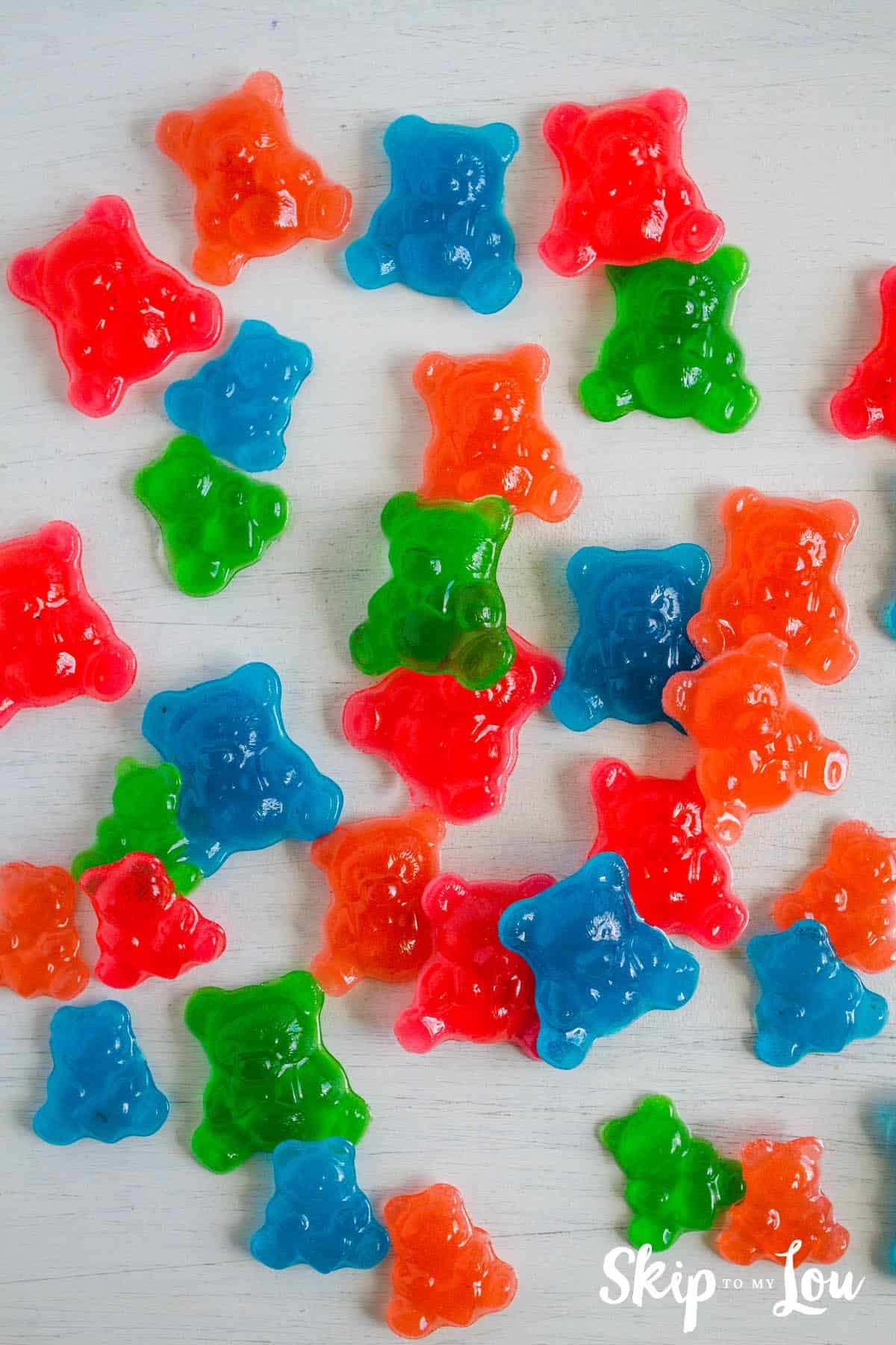 DIY homemade gummy candy made in fall-shaped silicone molds with juice and gelatin, an easy treat for kids