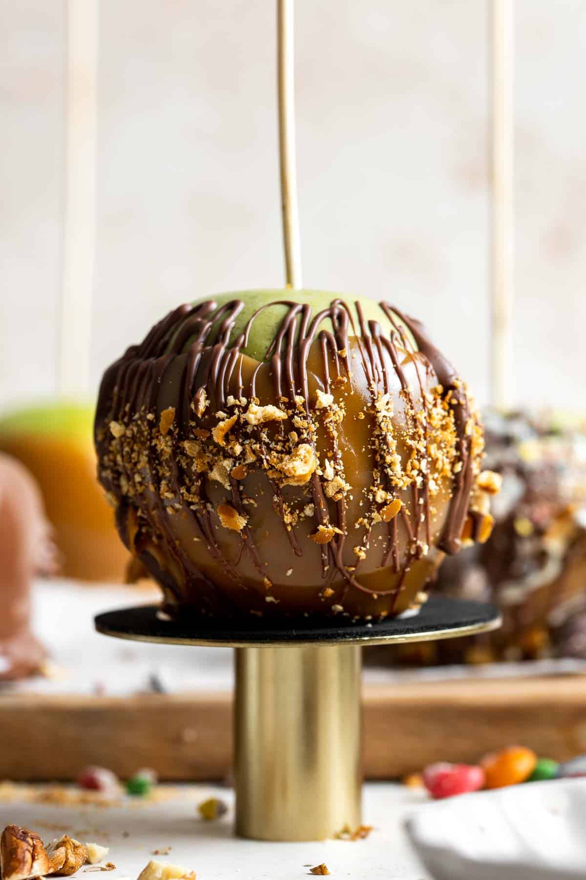 Easy appetizer recipe with dessert-table favorite and kid-friendly spooky serving, highlighting the finished caramel apples