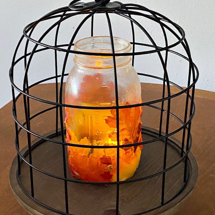 Autumn craft tutorial, creative harvest display and warm seasonal display style, showing mason jar leaf lanterns