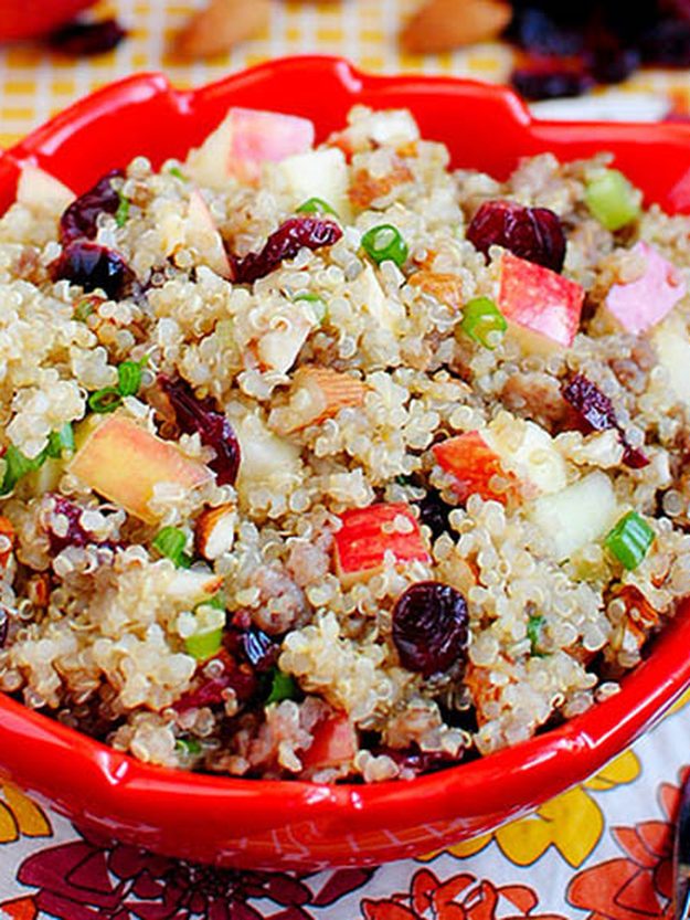 Apple Almond Quinoa Thanksgiving Side Quinoa with apple, cranberries, sliced almonds, green onion and maple sausage in a colorful serving bowl