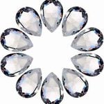 Clear faceted teardrop crystal beads arranged in a circle for a handmade beaded Christmas wreath ornament