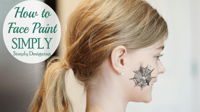 Sparkly Halloween face paint showing a silver spiderweb glitter design on the side of a woman's face