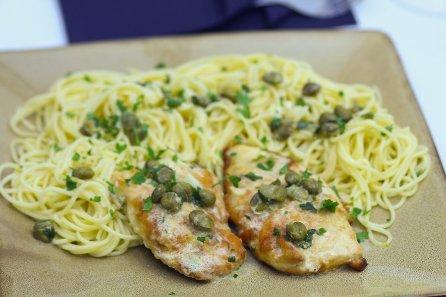 Chicken Dinner Recipes, piccata cutlets plated over angel hair pasta with capers and lemon butter sauce spooned over