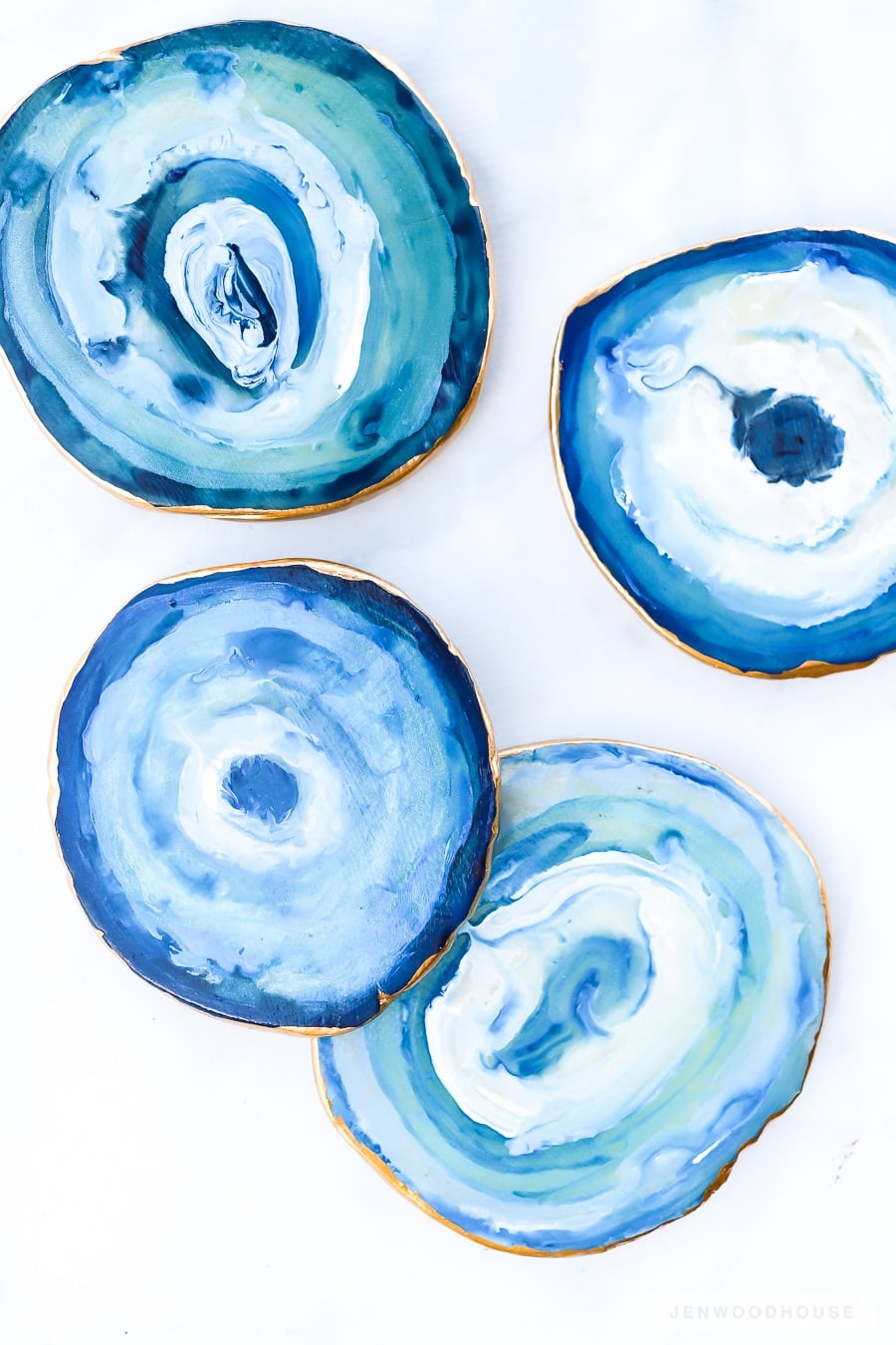 Homemade gift for mom, four faux agate coasters marbled in blue and white with gilded gold painted edges