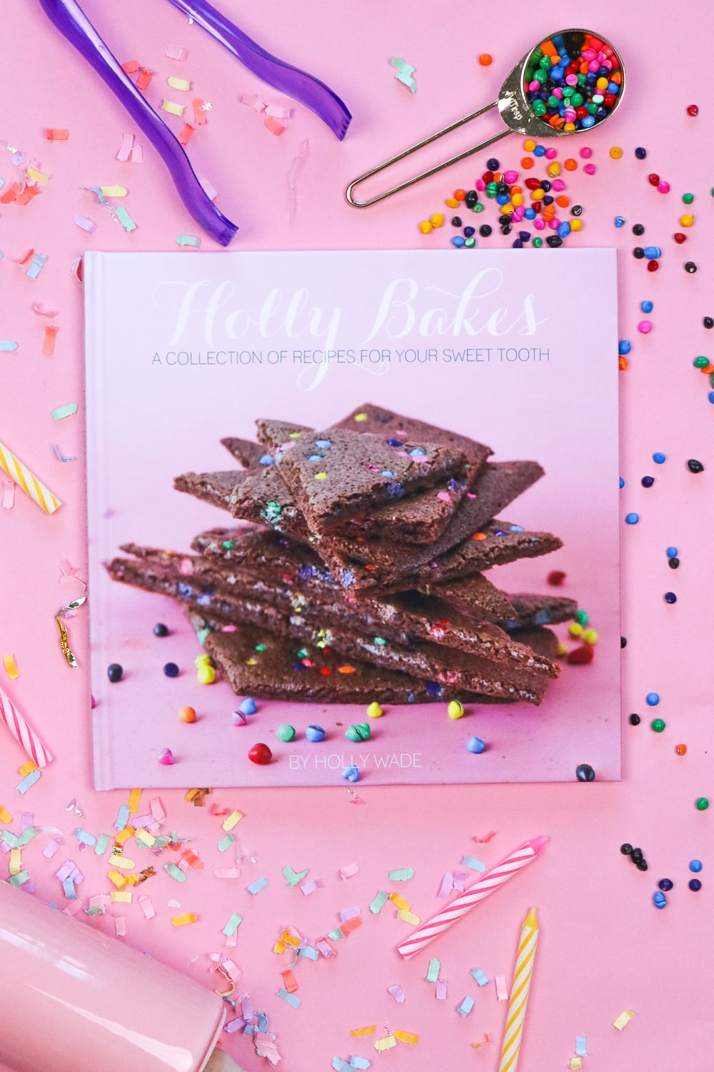 Homemade gift for mom, custom printed hardcover family recipe book styled on a counter with baking tools