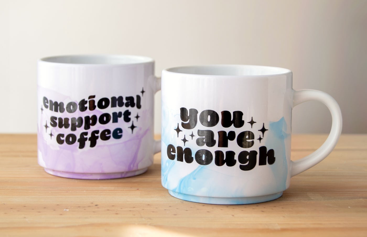 Homemade gift for mom, plain white mugs marbled with swirled nail polish in blue and gold tones