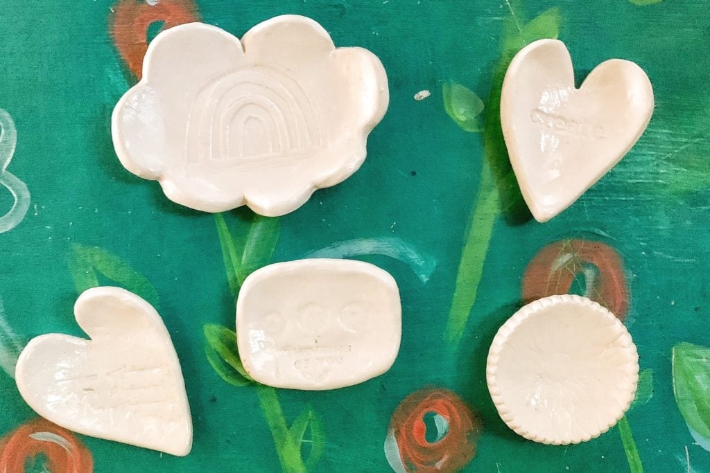 Gifts to make for mom, five small glazed air dry clay trinket dishes in cloud, heart, rectangle and scalloped circle shapes