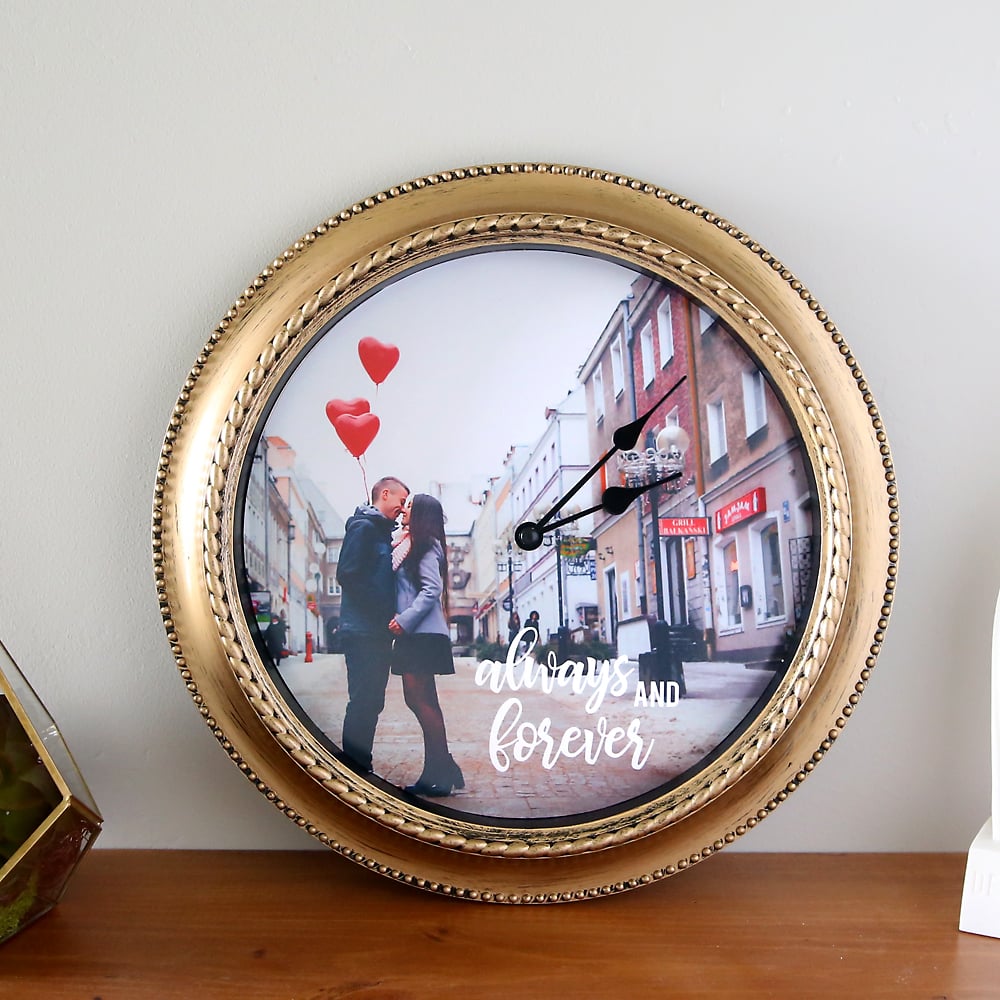 Homemade gift for mom, gold framed round wall clock with a personalized photo and hand lettering behind the hands