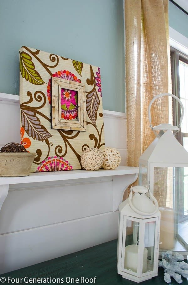 Fabric-covered canvas wall art stretched over a frame, an easy DIY home decor craft that sells at craft fairs and on Etsy