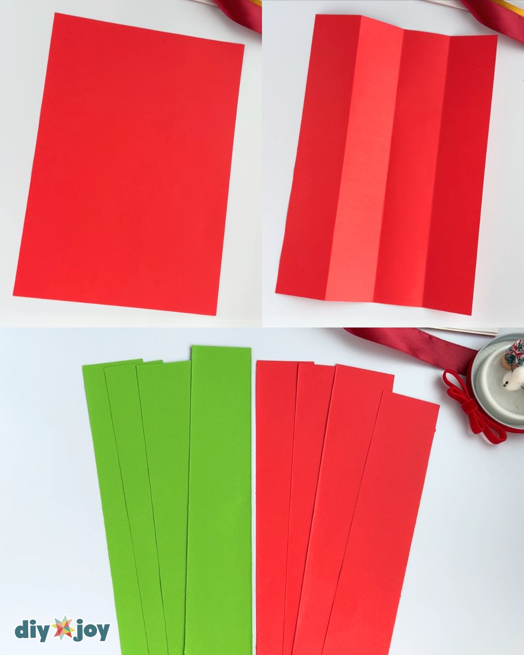 Red paper folded lengthwise into quarters and cut into green and red strips, step one of this DIY Christmas decor craft