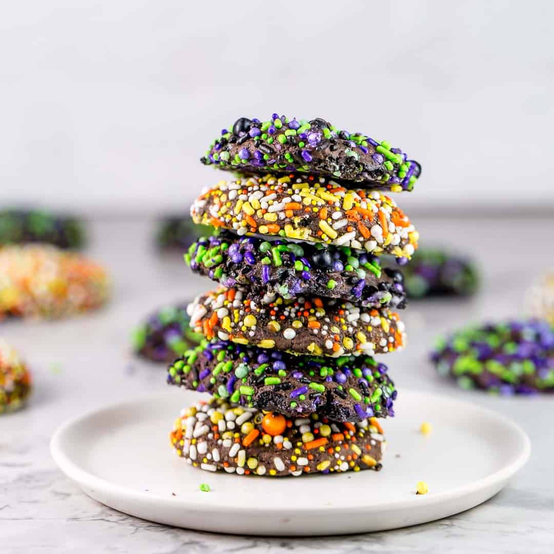 Chocolate Halloween Sprinkle Cookies Stack of soft chocolate cookies coated with orange, yellow, purple and green Halloween sprinkles for a party