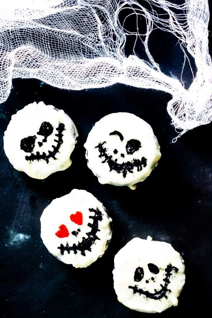 Jack Skellington Halloween Oreo Cookies White chocolate covered Oreo cookies drawn with black Jack Skellington faces after the coating sets for Halloween