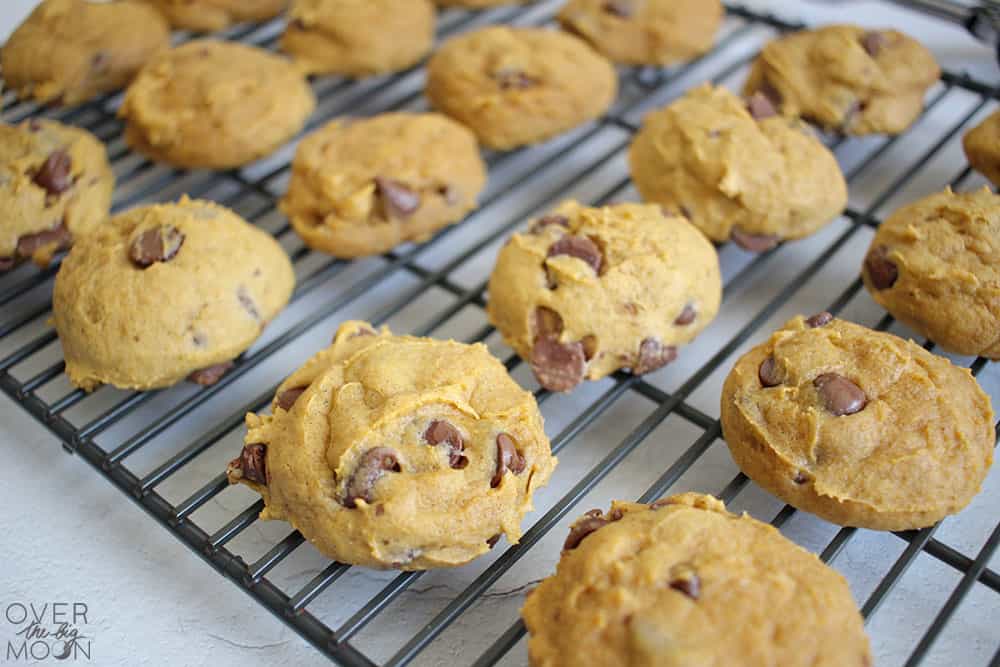 Soft Pumpkin Chocolate Chip Cookies Soft pumpkin chocolate chip cookies cooling on wire racks with visible chocolate chips and a source watermark