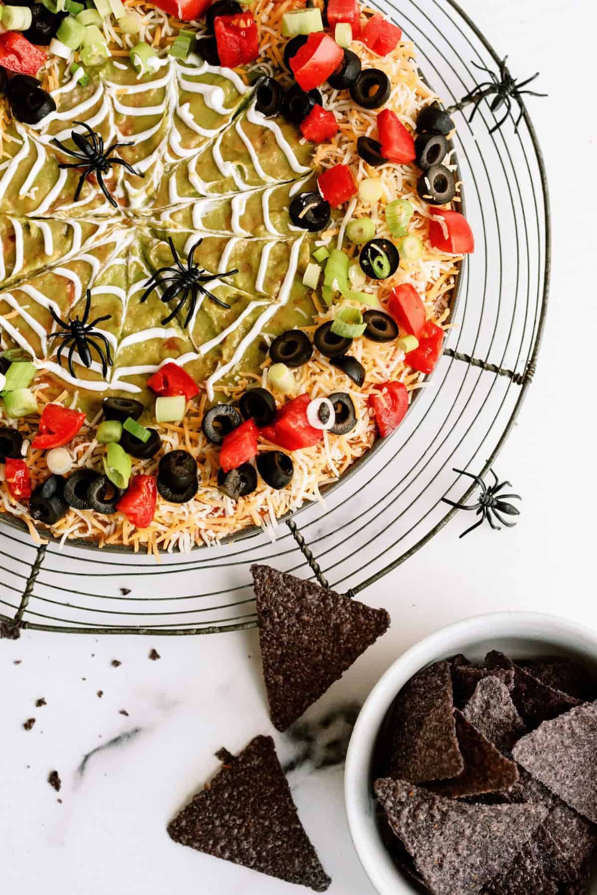 Halloween food idea, dessert-table favorite and kid-friendly spooky serving, focused on spooky Halloween 7 layer dip