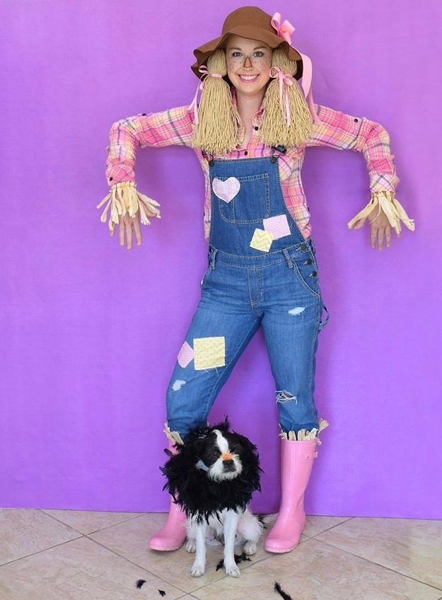 Scarecrow Halloween costume and makeup with an orange nose, freckles, stitched smile, overalls and straw hat