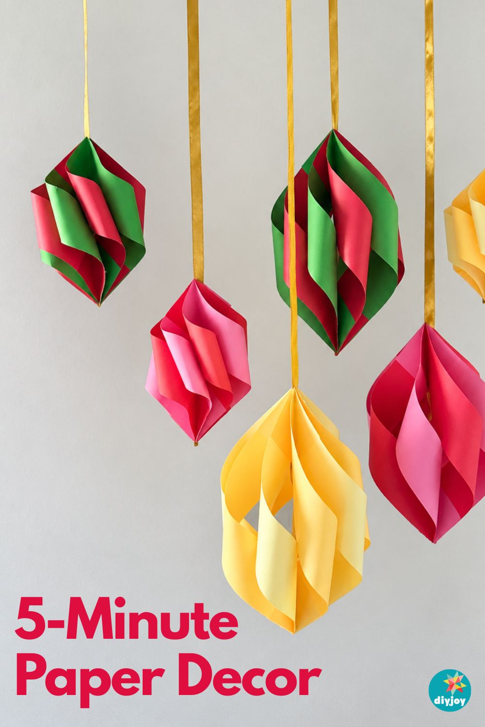 Pinterest image of folded paper ornaments in red, green and yellow labeled 5-Minute Paper Decor, quick DIY Christmas decor