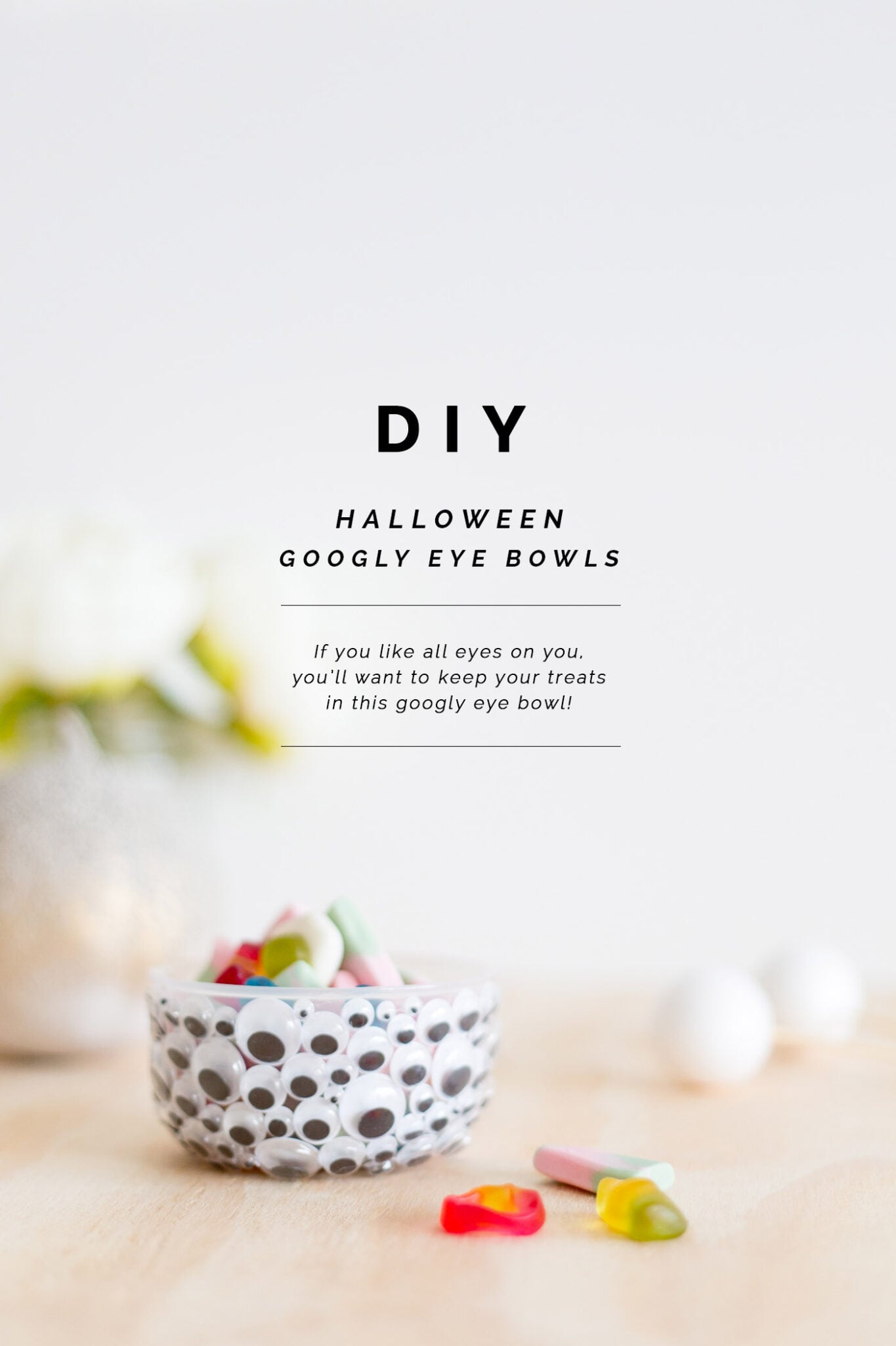 Small bowl covered with assorted black and white googly eyes appears in a portrait graphic with Fall For DIY title text
