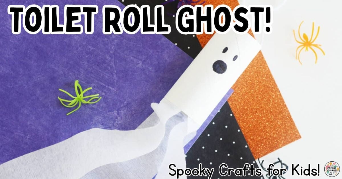 White toilet roll ghost hangs by yarn with a hand-drawn black face and three long fluttering paper streamers