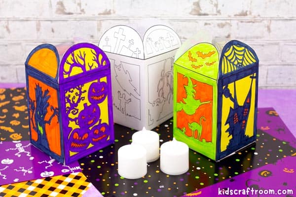 Three paper Halloween lanterns show bats, a haunted house and graveyard panels beside a Kids Craft Room watermark