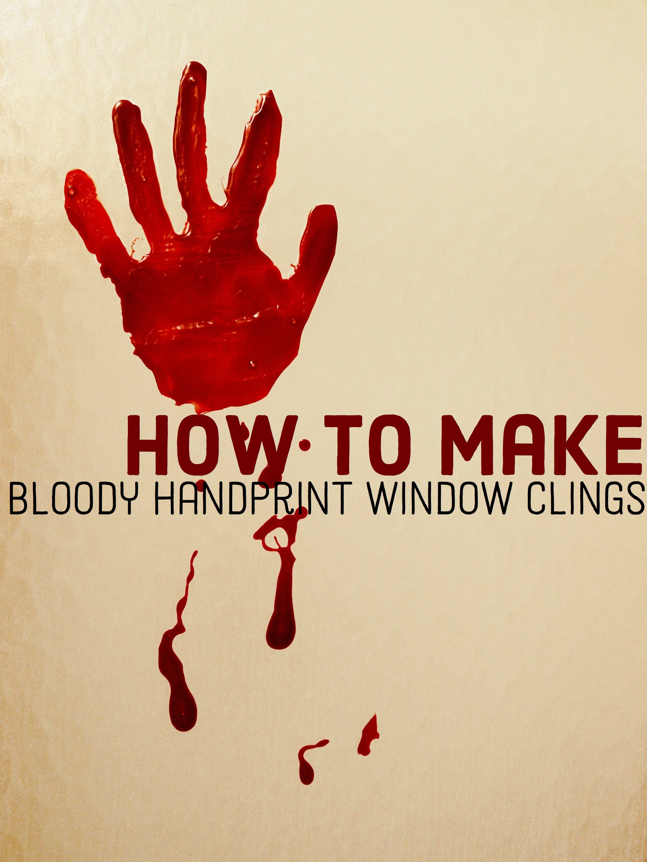 Red translucent bloody handprint window clings spread across clear glass with irregular drips and fingerprints
