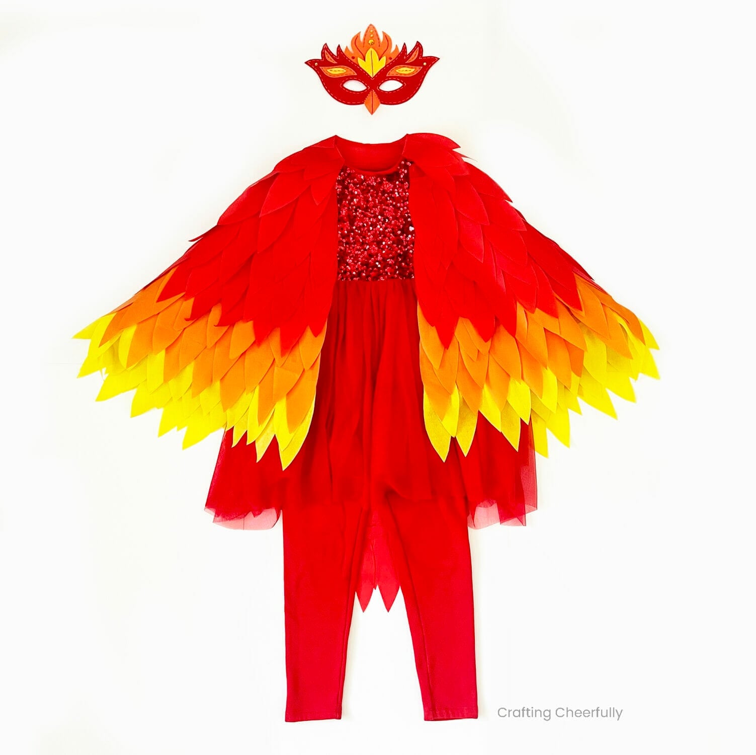 Red phoenix costume laid flat with feathered wings, sequin dress, leggings and a red and gold bird mask