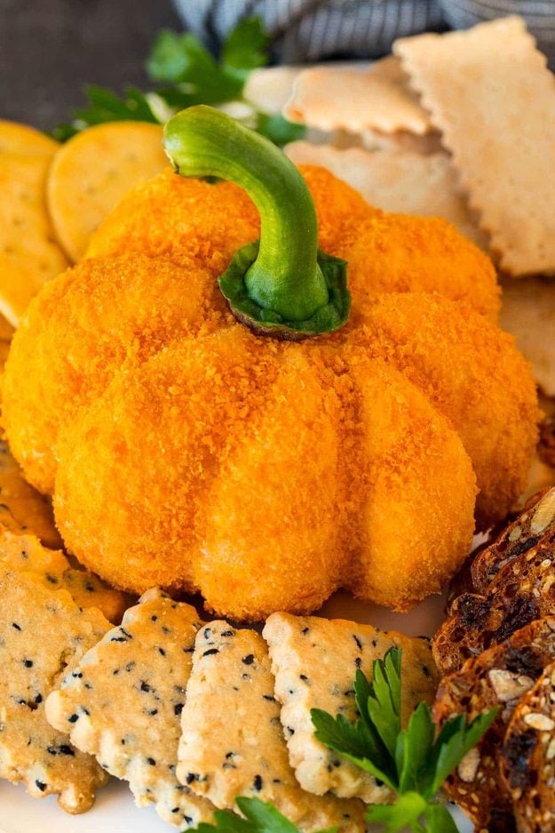 Spooky snack recipe with homemade party-table idea and creative Halloween recipe, featuring the finished pumpkin cheese ball