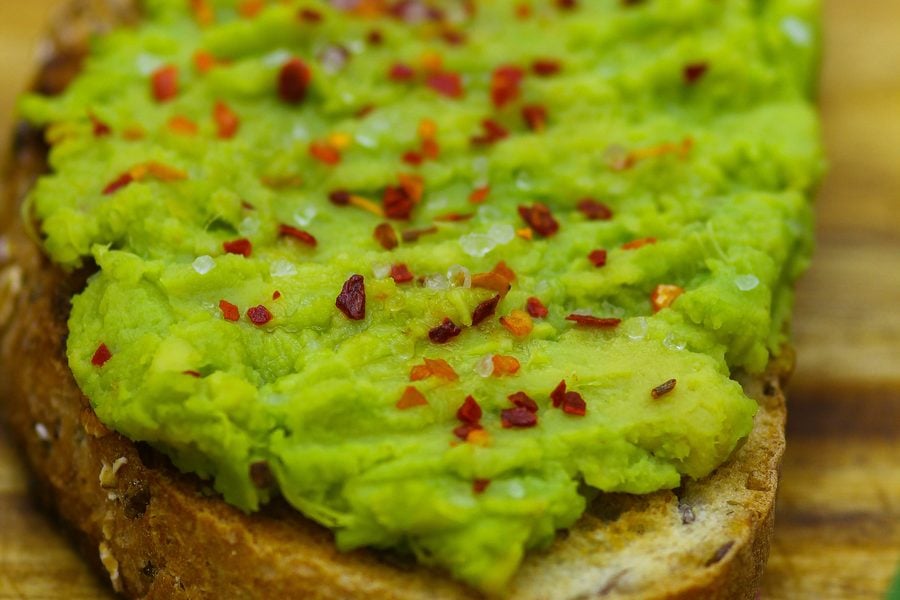 Avocado toast with olive oil, lemon juice, red pepper flakes and flaky salt