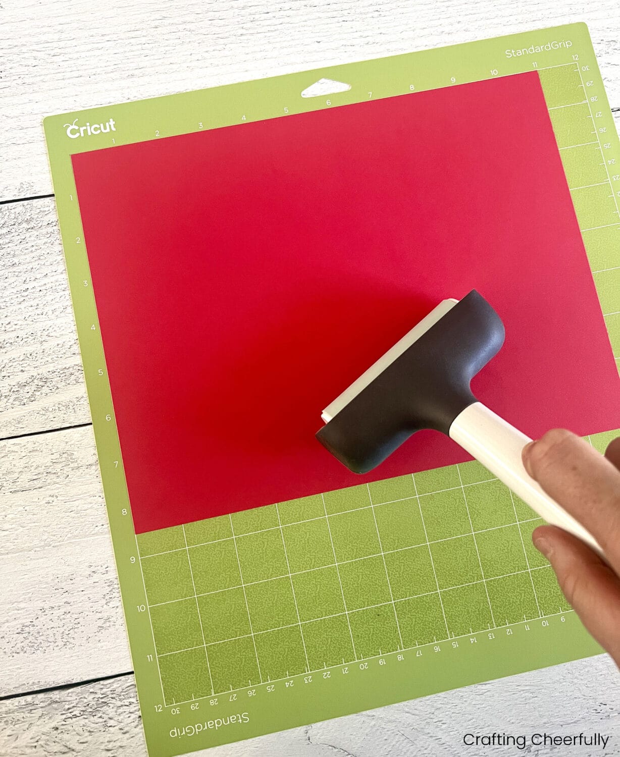 Printable apple boxes in red cardstock with gold glitter apple cutouts holding a teacher gift card beside colored pencils