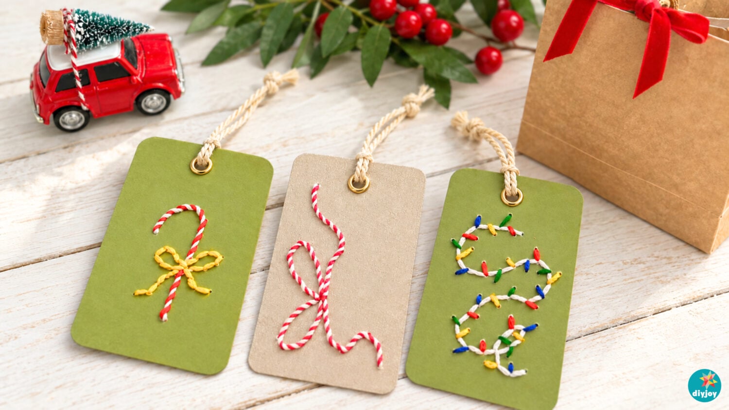 Embroidered Christmas gift tags - three green and kraft cardstock tags stitched with candy cane and lights designs